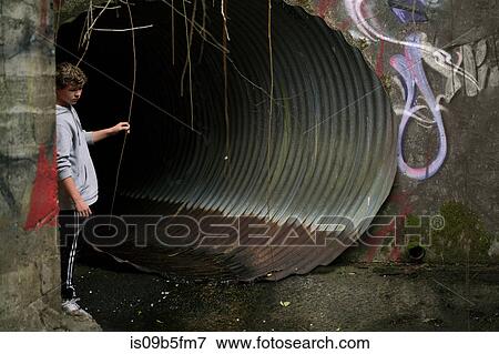 Boy in sewer, Pacific Rim National Park, Vancouver Island, Canada View Large Photo Image Stock Photo - Boy in sewer, Pacific Rim National Park, Vancouver Island, Canada. Fotosearch