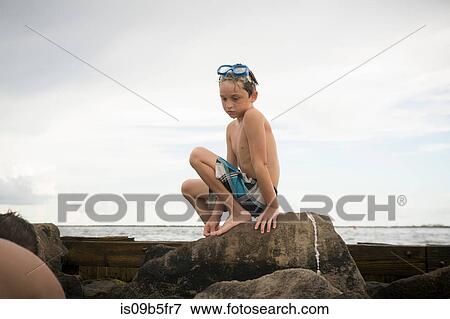Boy rock pooling, Gulf of Mexico, Emerald Coast, Florida, USA View Large Photo Image Stock Photo - Boy rock pooling, Gulf of Mexico, Emerald Coast, Florida, USA. Fotosearch