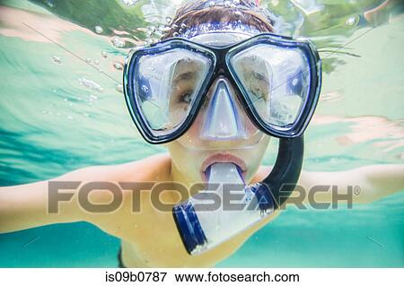 Boy snorkeling in clear spring water, Econfina Springs, Florida, USA View Large Photo Image Stock Photo - Boy snorkeling in clear spring water, Econfina Springs, Florida, USA. Fotosearch