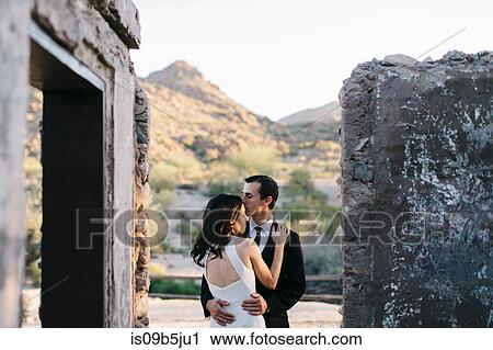 Bride and groom, outdoors, in romantic embrace View Large Photo Image Stock Image - Bride and groom, outdoors, in romantic embrace. Fotosearch
