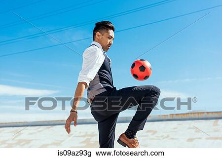 Businessman playing with soccer ball on Los Angeles river, California, USA View Large Photo Image Stock Image - Businessman playing with soccer ball on Los Angeles river, California, USA. Fotosearch