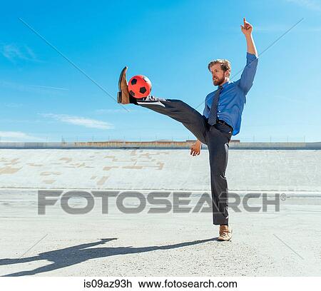 Businessman playing with soccer ball on Los Angeles river, California, USA View Large Photo Image Stock Image - Businessman playing with soccer ball on Los Angeles river, California, USA. Fotosearch