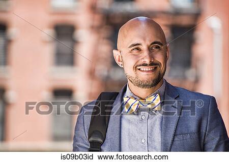 Businessman walking outdoors, smiling View Large Photo Image Stock Image - Businessman walking outdoors, smiling. Fotosearch