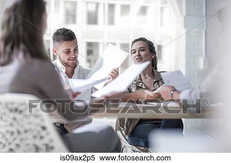 Businessmen and businesswomen brainstorming in loft office View Large Photo Image Stock Photography - Businessmen and businesswomen brainstorming in loft office. Fotosearch