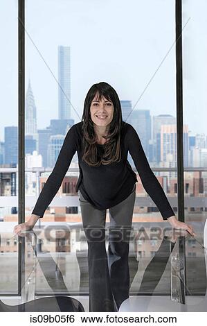 Stock Photograph - Businesswoman in office. Fotosearch