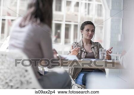 Picture - Businesswomen brainstorming in loft office. Fotosearch
