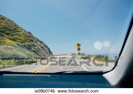 Car windscreen view of winding coast road, Big Sur, California, USA View Large Photo Image Stock Image - Car windscreen view of winding coast road, Big Sur, California, USA. Fotosearch