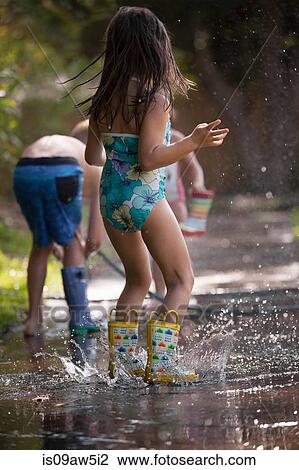 Children playing with water hose on sidewalk View Large Photo Image Stock Image - Children playing with water hose on sidewalk. Fotosearch