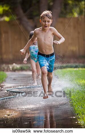 Children running in water on sidewalk View Large Photo Image Stock Image - Children running in water on sidewalk. Fotosearch