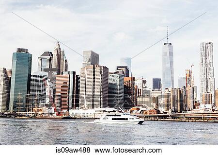Cityscape of East river and Freedom Tower, New York, USA View Large Photo Image Stock Photo - Cityscape of East river and Freedom Tower, New York, USA. Fotosearch