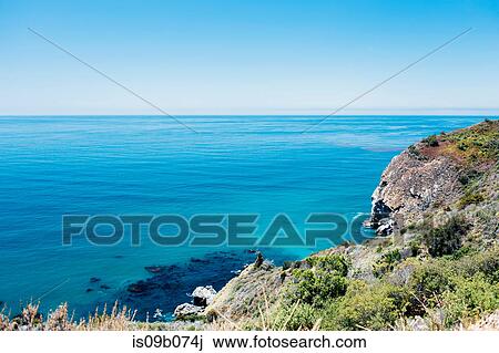 Cliff and blue sea view, Big Sur, California, USA View Large Photo Image Stock Image - Cliff and blue sea view, Big Sur, California, USA. Fotosearch