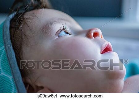 Close up of baby boy gazing View Large Photo Image Stock Photograph - Close up of baby boy gazing. Fotosearch