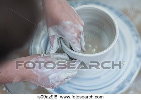 Close up of female potter's hands shaping clay bowl on pottery wheel in workshop View Large Photo Image Stock Photography - Close up of female potter's hands shaping clay bowl on pottery wheel in workshop. Fotosearch