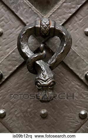 Close up of wrought iron snake-shaped door knob View Large Photo Image Stock Photography - Close up of wrought iron snake-shaped door knob. Fotosearch