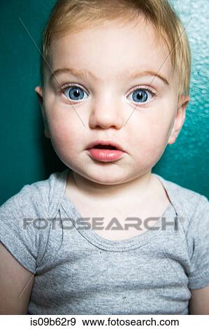 Close up portrait of cute blue eyed baby boy View Large Photo Image Stock Photo - Close up portrait of cute blue eyed baby boy. Fotosearch