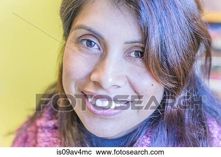 Close up portrait of mature female student in library View Large Photo Image Stock Image - Close up portrait of mature female student in library. Fotosearch