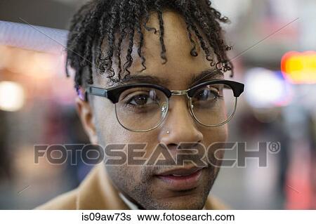 Stock Photograph - Close up portrait of young businessman in train station. Fotosearch