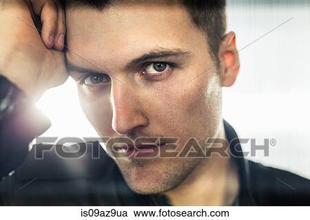 Close up portrait of young man, hand on head, looking at camera View Large Photo Image Stock Image - Close up portrait of young man, hand on head, looking at camera. Fotosearch