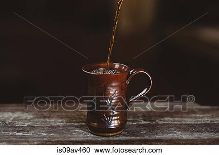 Coffee being poured into mug View Large Photo Image Stock Image - Coffee being poured into mug. Fotosearch