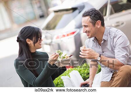Couple at sidewalk cafe enjoying lunch View Large Photo Image Stock Image - Couple at sidewalk cafe enjoying lunch. Fotosearch