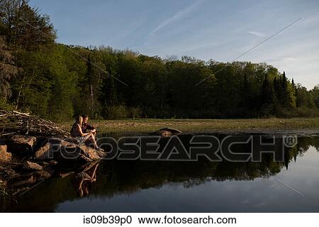 Stock Image - Couple enjoying lake, Ottawa, Ontario. Fotosearch