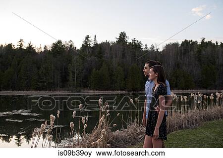 Couple enjoying lake, Ottawa, Ontario View Large Photo Image Stock Photo - Couple enjoying lake, Ottawa, Ontario. Fotosearch