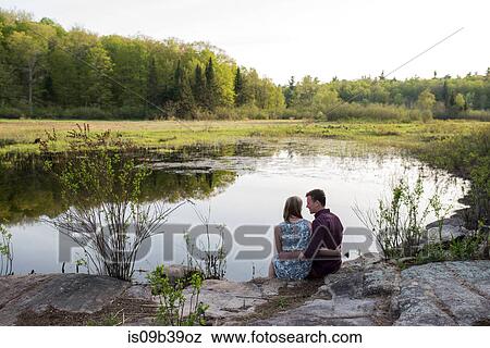 Couple enjoying lake, Ottawa, Ontario View Large Photo Image Stock Photo - Couple enjoying lake, Ottawa, Ontario. Fotosearch