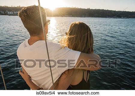Couple enjoying sunset on sailboat, San Diego Bay, California, USA View Large Photo Image Picture - Couple enjoying sunset on sailboat, San Diego Bay, California, USA. Fotosearch