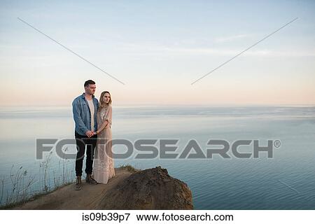 Couple enjoying view on cliff, Ottawa, Ontario View Large Photo Image Stock Photo - Couple enjoying view on cliff, Ottawa, Ontario. Fotosearch
