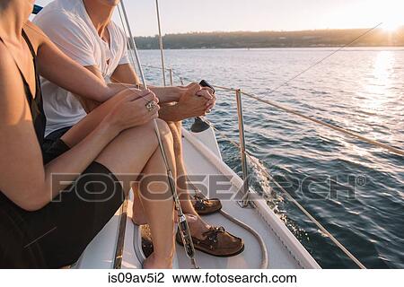 Couple enjoying view on sailboat, San Diego Bay, California, USA View Large Photo Image Stock Image - Couple enjoying view on sailboat, San Diego Bay, California, USA. Fotosearch