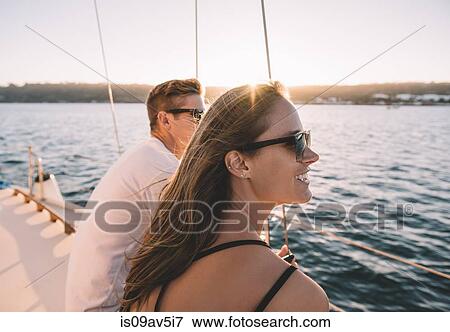 Couple enjoying view on sailboat, San Diego Bay, California, USA View Large Photo Image Stock Photo - Couple enjoying view on sailboat, San Diego Bay, California, USA. Fotosearch