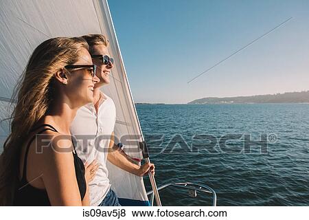 Stock Photo - Couple enjoying view on sailboat, San Diego Bay, California, USA. Fotosearch