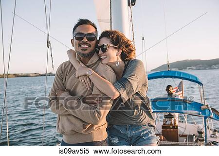 Stock Photography - Couple enjoying view on sailboat, San Diego Bay, California, USA. Fotosearch