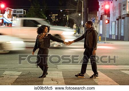 Couple holding hands on pedestrian crossing, Los Angeles, California, USA View Large Photo Image Stock Photography - Couple holding hands on pedestrian crossing, Los Angeles, California, USA. Fotosearch