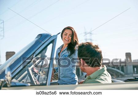 Couple in convertible car, Los Angeles, California, USA View Large Photo Image Stock Photograph - Couple in convertible car, Los Angeles, California, USA. Fotosearch