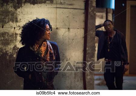 Couple in dimly lit alley, Los Angeles, California, USA View Large Photo Image Picture - Couple in dimly lit alley, Los Angeles, California, USA. Fotosearch