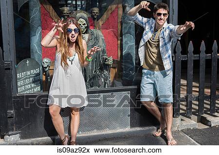 Couple in front of window display fooling around, Coney island, Brooklyn, New York, USA View Large Photo Image Stock Photo - Couple in front of window display fooling around, Coney island, Brooklyn, New York, USA. Fotosearch