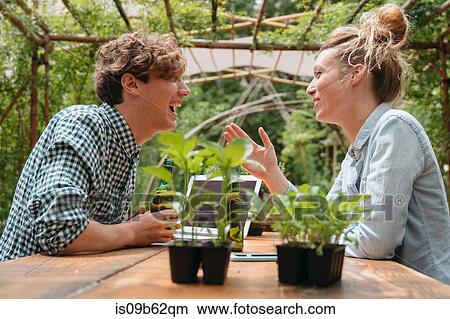 Couple in garden face to face smiling View Large Photo Image Picture - Couple in garden face to face smiling. Fotosearch