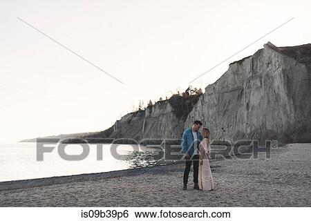 Stock Photograph - Couple on beach, Ottawa, Ontario. Fotosearch