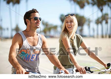 Picture - Couple on cycles at Venice Beach, Los Angeles, California, USA. Fotosearch