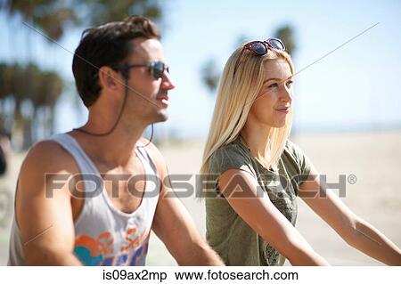 Couple on cycles at Venice Beach, Los Angeles, California, USA View Large Photo Image Stock Photography - Couple on cycles at Venice Beach, Los Angeles, California, USA. Fotosearch