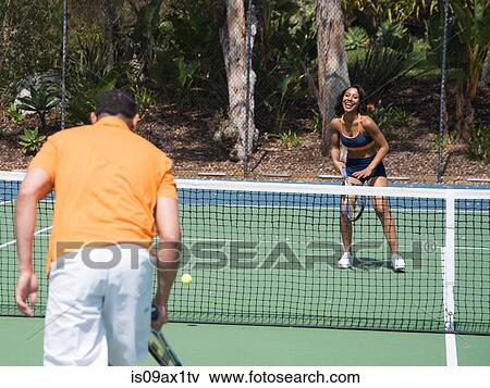 Couple playing tennis View Large Photo Image Stock Photo - Couple playing tennis. Fotosearch