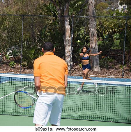 Couple playing tennis View Large Photo Image Stock Photograph - Couple playing tennis. Fotosearch