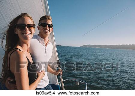Couple relaxing on sailboat, San Diego Bay, California, USA View Large Photo Image Picture - Couple relaxing on sailboat, San Diego Bay, California, USA. Fotosearch