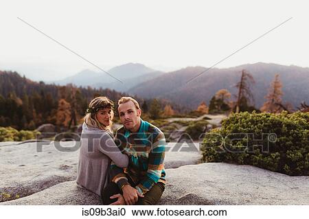 Couple sitting on rocks in mountains, Sequoia national park, California, USA View Large Photo Image Stock Image - Couple sitting on rocks in mountains, Sequoia national park, California, USA. Fotosearch