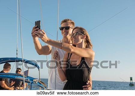 Couple taking selfie on sailboat, San Diego Bay, California, USA View Large Photo Image Stock Image - Couple taking selfie on sailboat, San Diego Bay, California, USA. Fotosearch