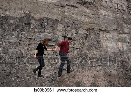 Couple walking on side of cliff, Ottawa, Ontario View Large Photo Image Stock Image - Couple walking on side of cliff, Ottawa, Ontario. Fotosearch