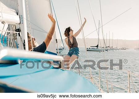 Couple waving on sailboat, San Diego Bay, California, USA View Large Photo Image Stock Image - Couple waving on sailboat, San Diego Bay, California, USA. Fotosearch