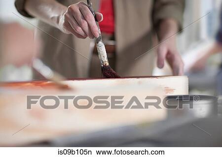 Cropped shot of female carpenter painting wood stain painting in furniture making workshop View Large Photo Image Picture - Cropped shot of female carpenter painting wood stain painting in furniture making workshop. Fotosearch