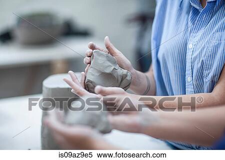 Cropped shot of two female potters shaping clay in workshop View Large Photo Image Stock Photography - Cropped shot of two female potters shaping clay in workshop. Fotosearch